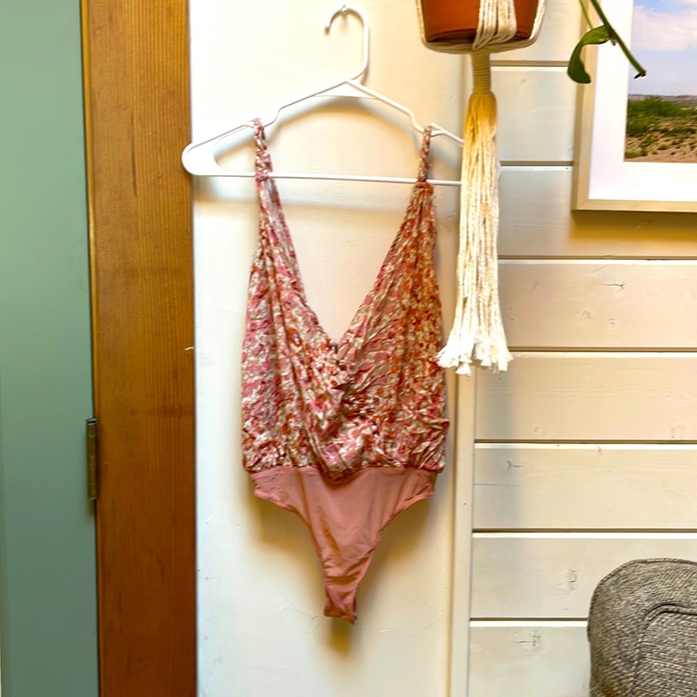 NWOT Free People floral bodysuit. Super cute! Just never wore it.